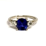 PLATINUM CUSHION SAPPHIRE AND DIAMOND RING