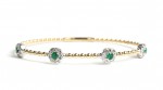 14K YELLOW AND WHITE GOLD DIAMOND AND EMERALD STATION FLEXIBLE BANGLE