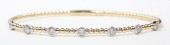 14K TWO TONE DIAMOND STATION FLEXIBLE BANGLE BRACELET .35CTW