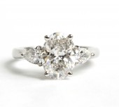 PLATINUM LAB GROWN OVAL DIAMOND WITH NATURAL PEAR SIDES ENGAGEMENT RING